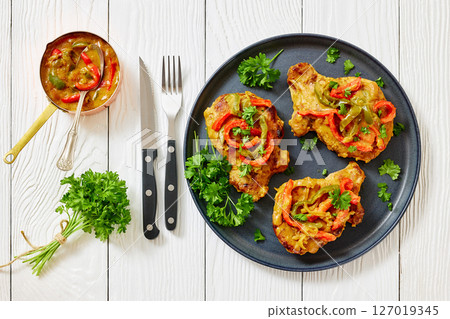 pork chops topped with bell pepper cream gravy pork chops topped with bell pepper cream gravy 127019345