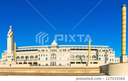 Olympic stadium in Barcelona with tall yellow columns and a grand facade Olympic stadium in Barcelona with tall yellow columns and a grand facade 127019368