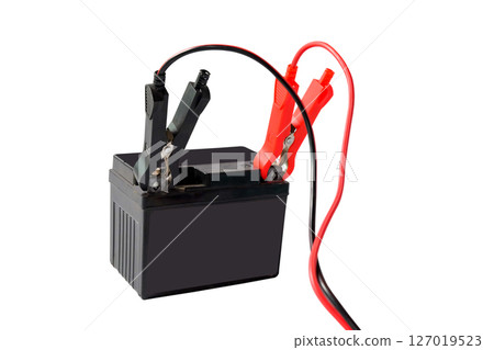 A motorcycle battery, charging with red and black cables. A motorcycle battery, charging with red and black cables. 127019523