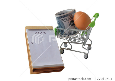 401k  Plan note with egg and Pile of US Money. 127019604