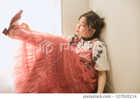 A young woman dressed in pop fashion A young woman dressed in pop fashion 127020214