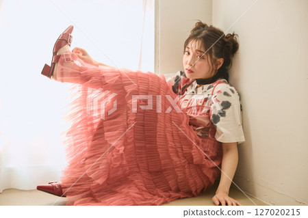 A young woman dressed in pop fashion A young woman dressed in pop fashion 127020215