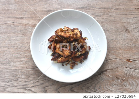 fried slice chicken meat with salt and garlic on plate fried slice chicken meat with salt and garlic on plate 127020694