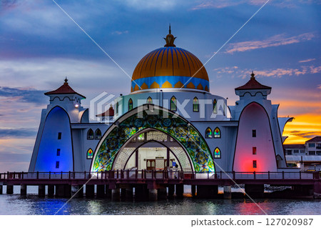 Bandar Melaka, Malaysia- April 16 2025.Masjid Selat Melaka is a landmark for tourist spot in Malacca.A landmark that attracts people to view the architecture landscape.The mosque is built on the sea. 127020987