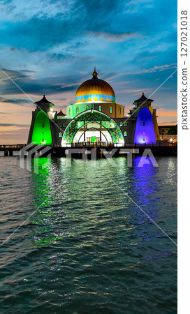 Bandar Melaka, Malaysia- April 16 2025.Masjid Selat Melaka is a landmark for tourist spot in Malacca.A landmark that attracts people to view the architecture landscape.The mosque is built on the sea. 127021018