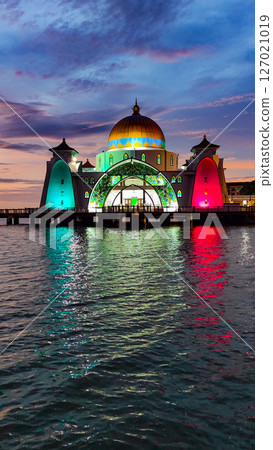 Bandar Melaka, Malaysia- April 16 2025.Masjid Selat Melaka is a landmark for tourist spot in Malacca.A landmark that attracts people to view the architecture landscape.The mosque is built on the sea. 127021019