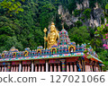 Gombak, Selangor Malaysia: April 18 2025: Batu Caves and the Murugan statue  (The Hindu god of war ) also known as Kartikeya , Skanda, Subrahmanya and Shanmukha. 127021066