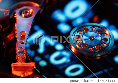 A hard disk with a blue binary code 127021333