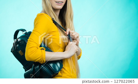 Teen girl with school backpack 127022065