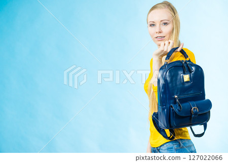 Teen girl with school backpack 127022066