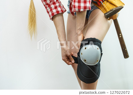 Person trying on knee pads Person trying on knee pads 127022072