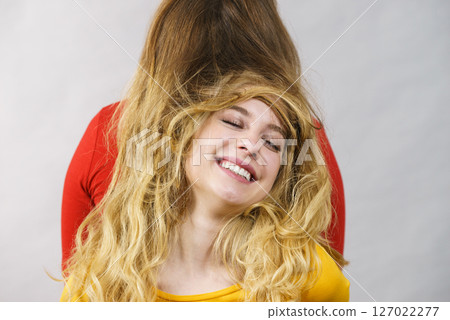 Two girls creating hairdo. Hair ombre color Two girls creating hairdo. Hair ombre color 127022277