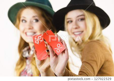 Two woman after sale shopping 127022329