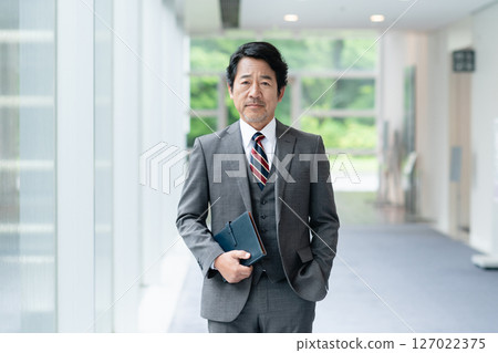 Executive businessman working in office Executive businessman working in office 127022375