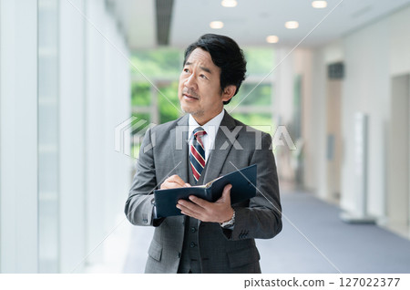 Executive businessman working in office Executive businessman working in office 127022377