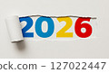 Colorful 2026 numbers under torn paper concept showing hidden New Year message in simple minimalist design 127022447