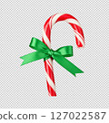 Festive candy cane tied with a vibrant green ribbon PNG clip art isolated on a transparent background. 127022587