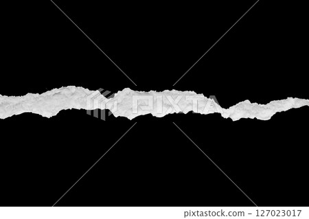 Ripped torn paper edges isolated on black background Ripped torn paper edges isolated on black background 127023017
