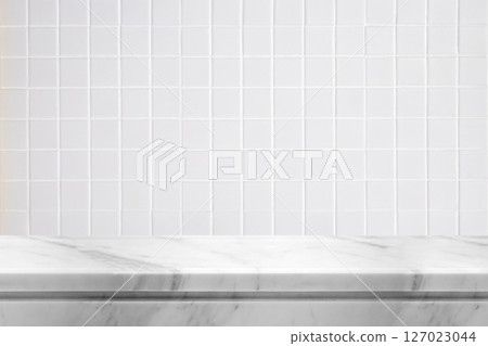 Empty white marble table top with blur tile wall bathroom background 127023044