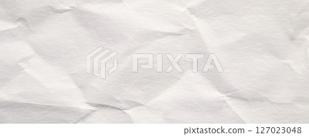 Abstract white crumpled and creased recycle paper texture background 127023048