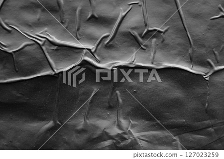 black crumpled and creased plastic poster texture background black crumpled and creased plastic poster texture background 127023259