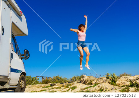 Woman enjoy trip with motorhome 127023518