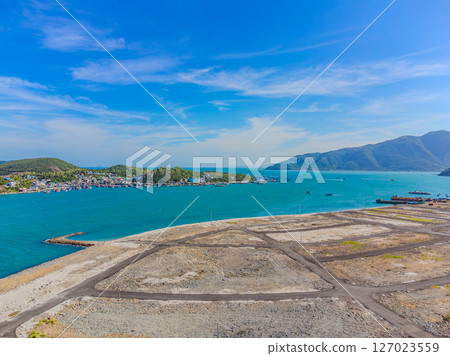 A construction site by the sea. 127023559
