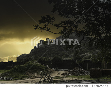 Dramatic Sunset Over Rocky Hills and Rural Landscape, Naga Hills, Kanke to Patratu Road, Ranchi, Jharkhand. 127025334