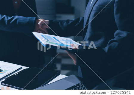 Close-up of handshake of businesswoman and businessman Close-up of handshake of businesswoman and businessman 127025541