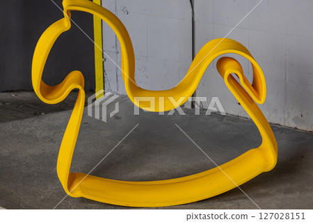 A toy yellow horse on the floor A toy yellow horse on the floor 127028151