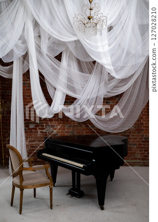Grand Piano Under Soft Draped Fabrics in Vintage Room 127028210