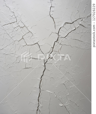 The wall is covered in cracks and peeling paint The wall is covered in cracks and peeling paint 127028229