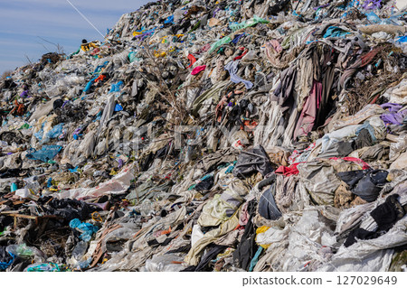 A vast landfill stacked with clothes, plastic, and trash underscores urgent pollution issues and the need for recycling A vast landfill stacked with clothes, plastic, and trash underscores urgent pollution issues and the need for recycling 127029649