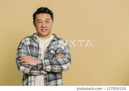 Happy Asian man smiling friendly glad expression feel satisfied concept good news celebrate win Happy Asian man smiling friendly glad expression feel satisfied concept good news celebrate win 127030128