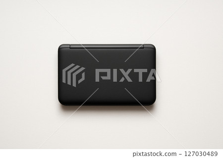 A simple black electronic dictionary placed on a white background 127030489
