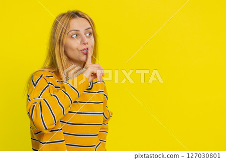 Woman presses finger to lips make silence gesture sign do not tells secret stop gossip privacy 127030801