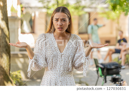 Confused young woman feeling embarrassed about ambiguous question having doubts no idea clueless Confused young woman feeling embarrassed about ambiguous question having doubts no idea clueless 127030831