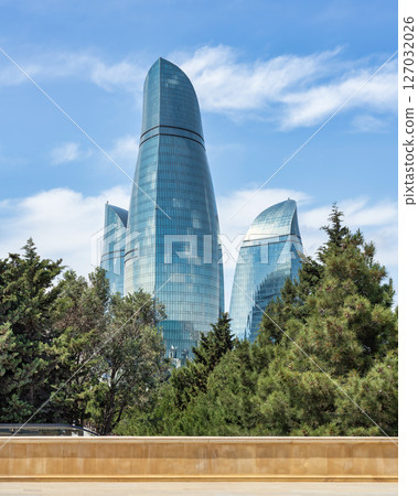 View from Martyrs Lane of the iconic Flame Towers in Baku, Azerbaijan stand tall against a blue sky, resembling flames 127032026