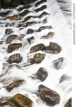 A firm stone in the rapids A firm stone in the rapids 127032054