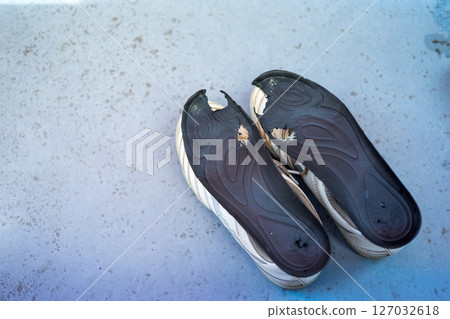 Holes in the toes of shoe insoles 127032618