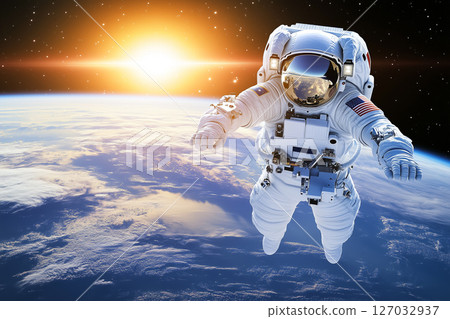 Astronaut Floating in Space with Earth and Stars During a Stunning Sunrise in the Background 127032937