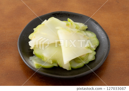 Pickled zha cai served on a small plate Pickled zha cai served on a small plate 127033087