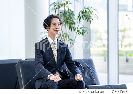 Businessmen sitting on sofas in the lobby. Photo courtesy of Sky Perfect Tokyo Media Center. Businessmen sitting on sofas in the lobby. Photo courtesy of Sky Perfect Tokyo Media Center. 127035671