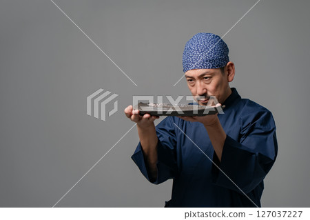 Male potter wearing work clothes 127037227