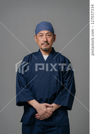 Portrait of a man wearing a work uniform 127037334