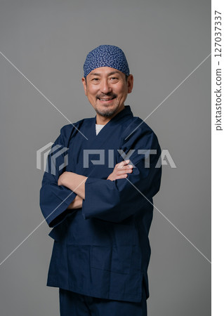 Portrait of a man wearing a work uniform Portrait of a man wearing a work uniform 127037337