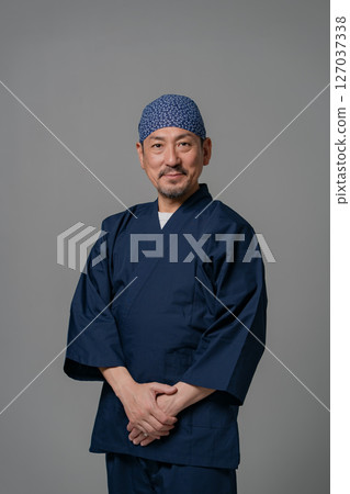 Portrait of a man wearing a work uniform 127037338
