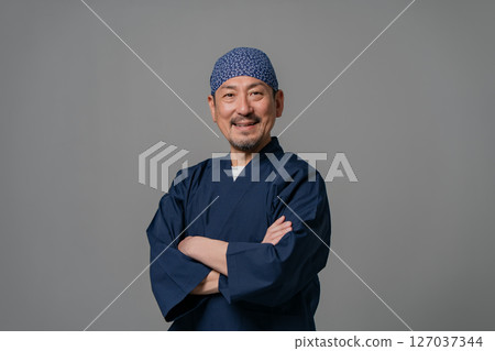 Portrait of a man wearing a work uniform Portrait of a man wearing a work uniform 127037344