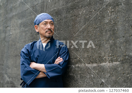 Portrait of a man wearing a work uniform 127037460