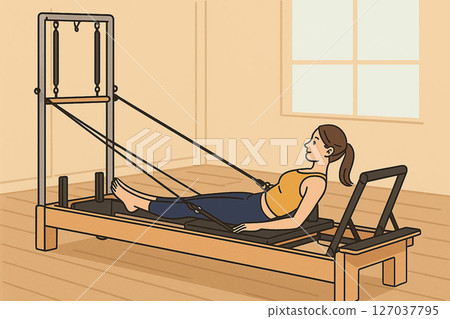 Female pilates training on reformer Female pilates training on reformer 127037795